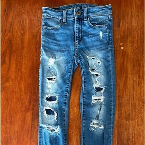 ‘American Eagle’ ripped super stretch denim blue jeans.